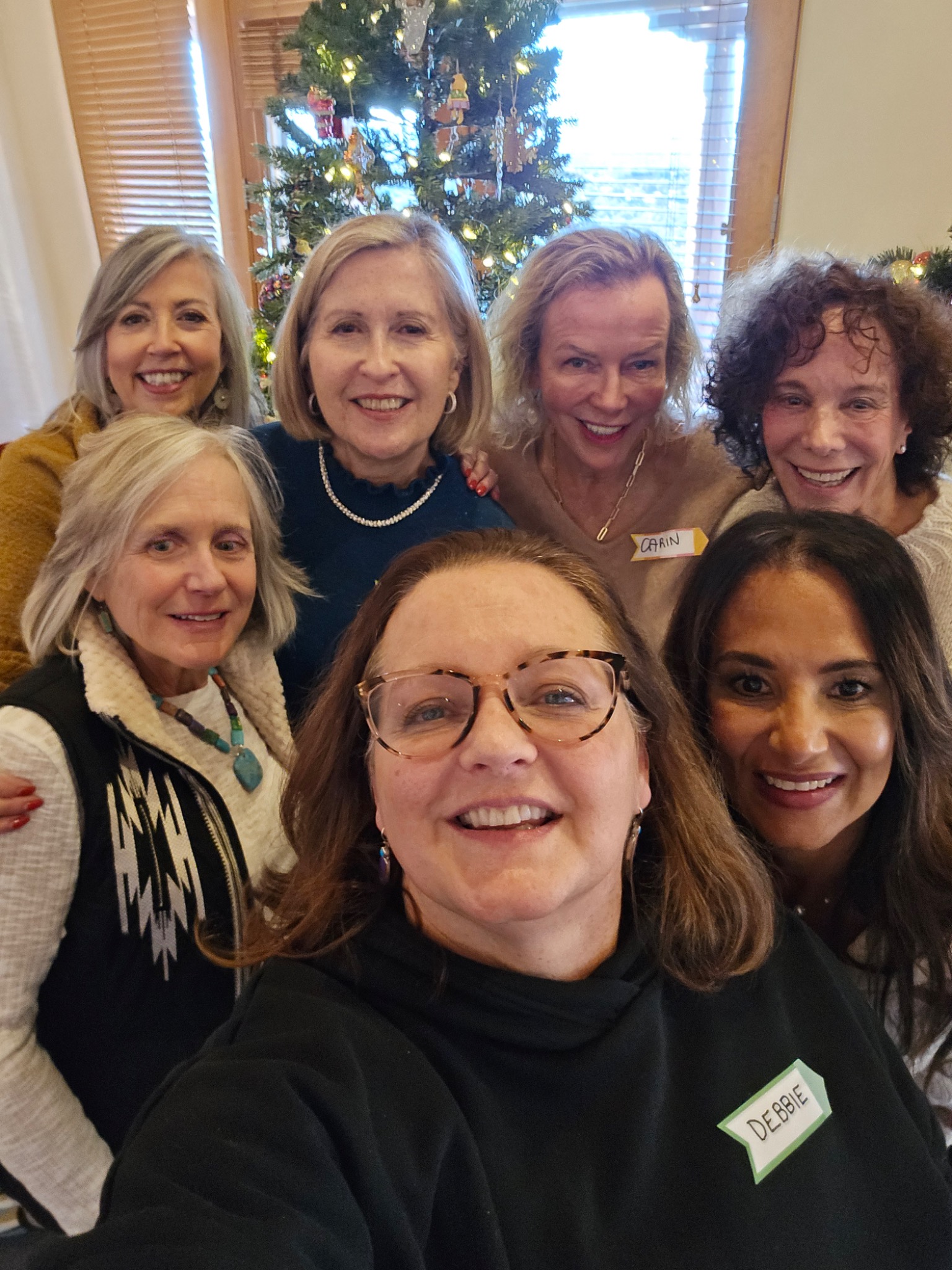 Debbie with a group at a holiday gathering