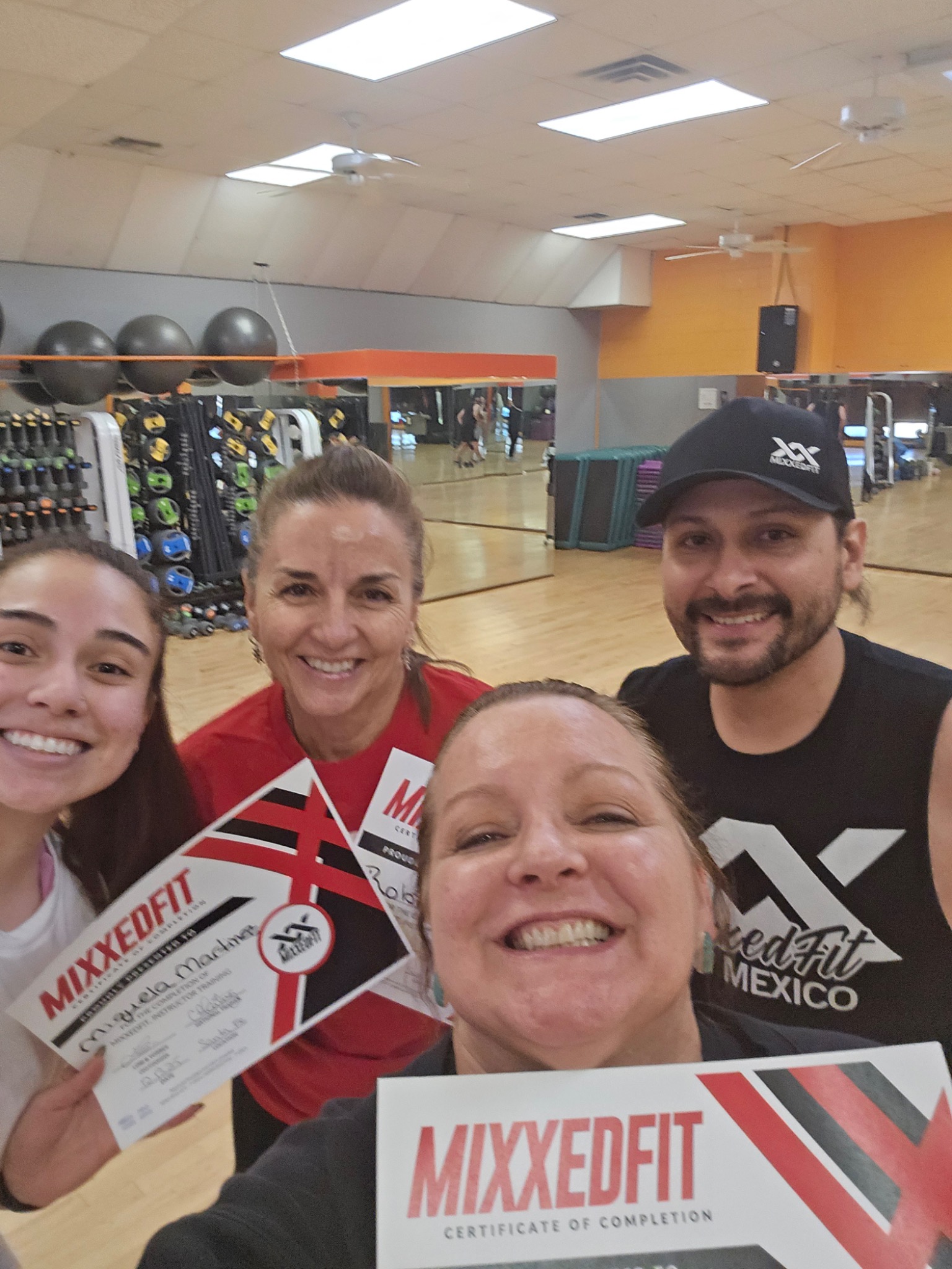 Debbie with group holding MixxedFit certificates