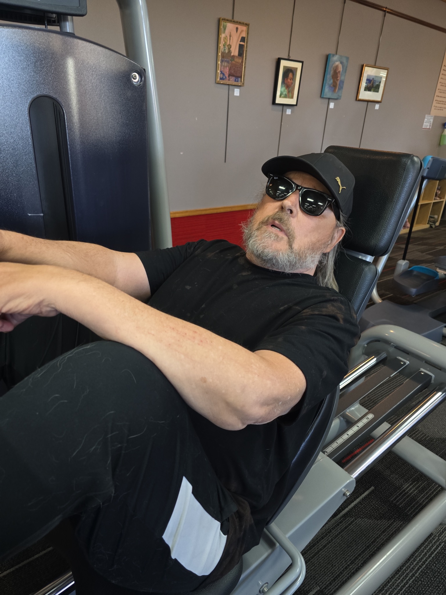 Client training on a machine at the gym